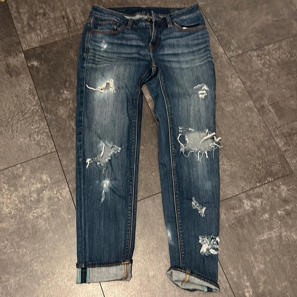 Distressed skinny ankle jeans